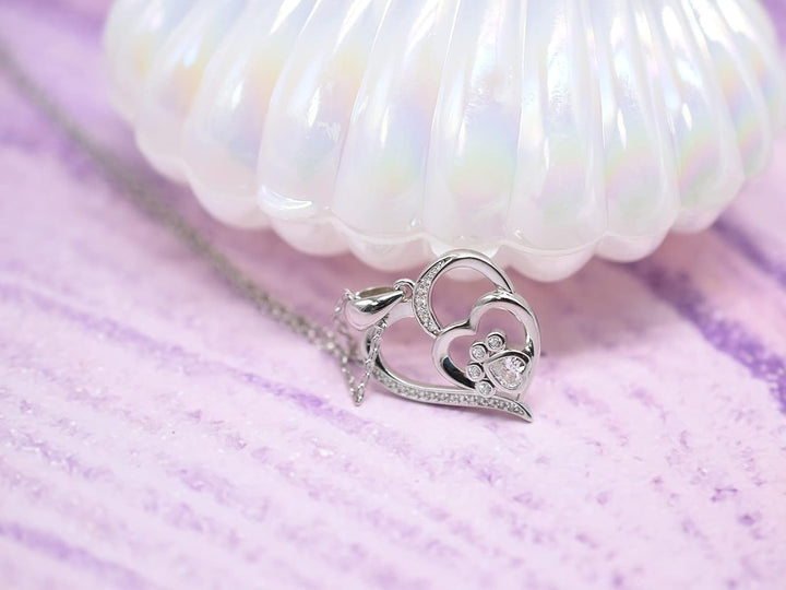 Collana in argento sterling con zampa e cuore con zirconi