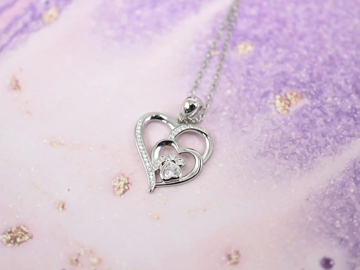 Collana in argento sterling con zampa e cuore con zirconi