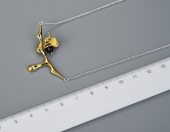 Collana con miele che gocciola e ape